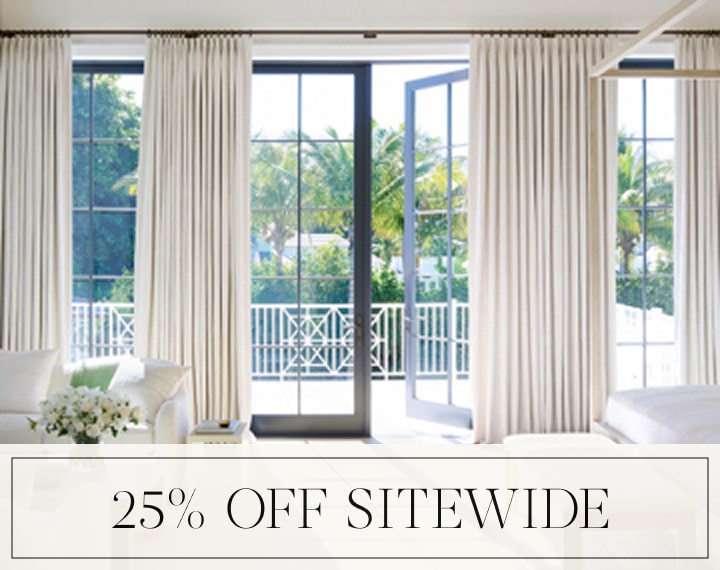 25% Off Sitewide in black text over an image of Tailored Pleat Drapery on bedroom patio doors.