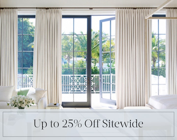 Up to 25% Off Sitewide in black text over an image of Tailored Pleat Drapery on bedroom patio doors.
