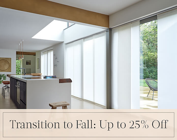 Transition to Fall: Up to 25% Off in black text over an image of Panel Track Vertical Blinds on patio doors in a kitchen