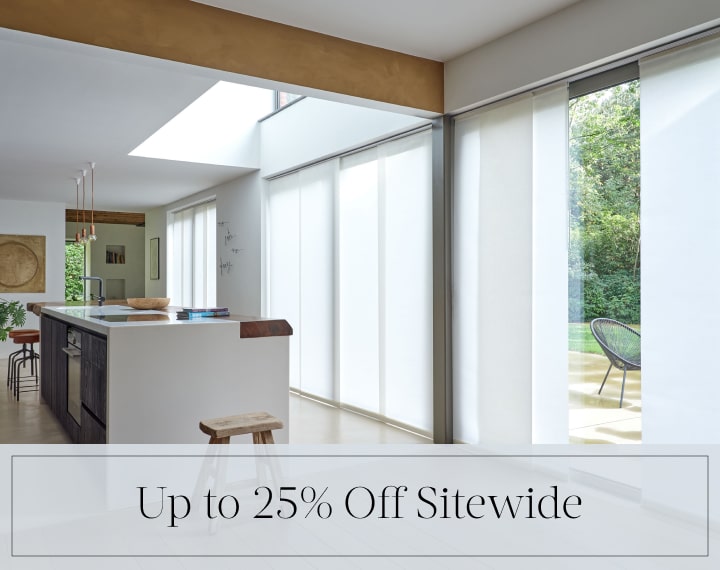 Up to 25% Off Sitewide in black text over an image of Panel Track Vertical Blinds on patio doors.