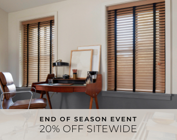 2 Inch Oak Wood Blinds hung over windows in an office with a wooden desk and brown office chair with 20 Percent Sitewide text