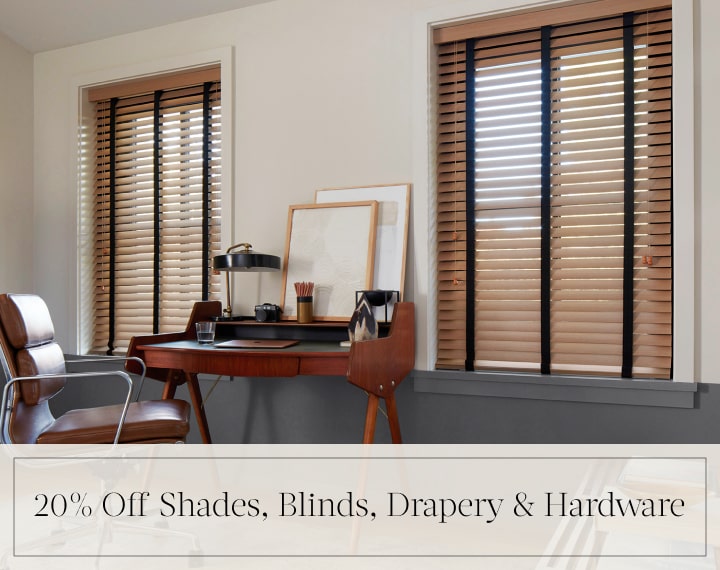 20% Off Shades, Blinds, Drapery & Hardware in black text over an image of office windows dressed with Oak Wood Blinds.