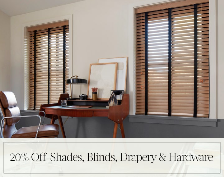 20% Off Shades, Blinds, Drapery & Hardware in black text over an image of office windows dressed with Oak Wood Blinds.