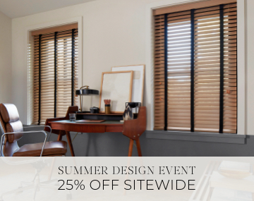 Oak Wood Blinds hang in an office with a wood desk & leather chair with sales messaging for Summer Design Event 25% Off