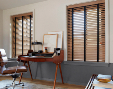 2 Inch Oak Wood Blinds with Noir decorative tape hang in a mid-century modern office with a wood desk & leather chair