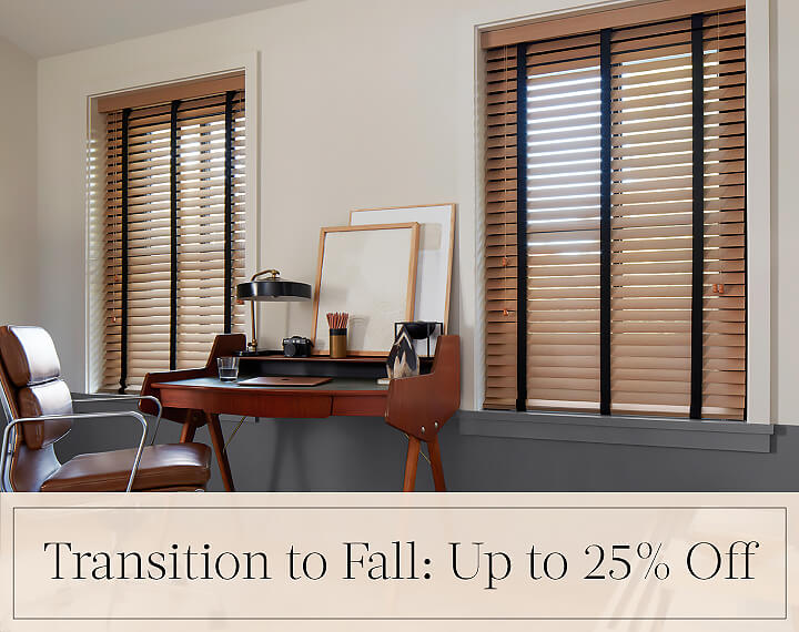 Transition to Fall: Up to 25% Off in black text over an image of Oak Wood Blinds in an office with a wood desk and chair