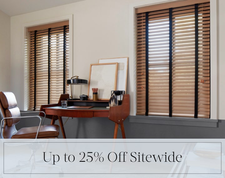 Up to 25% Off Sitewide in black text over an image of office windows dressed with Oak Wood Blinds.