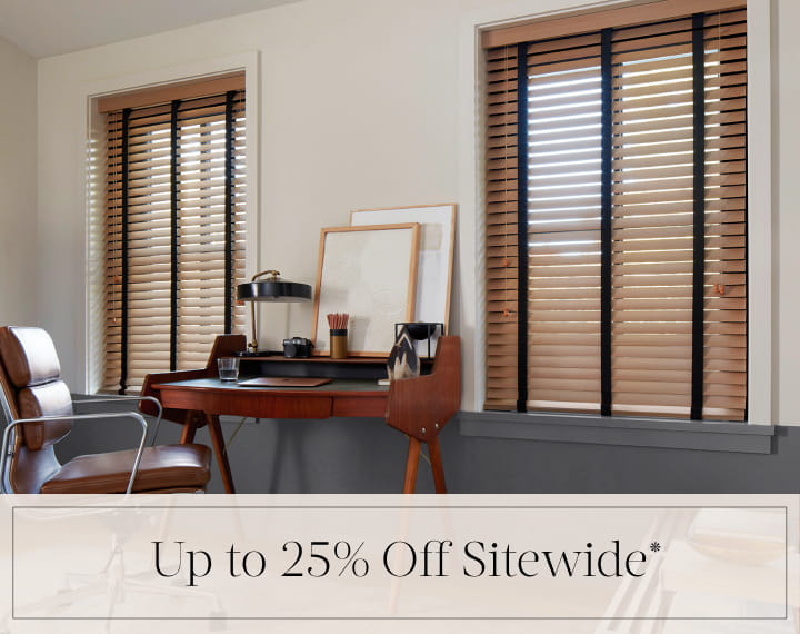 Up to 25% Off Sitewide in black text over an image of office windows dressed with Oak Wood Blinds.