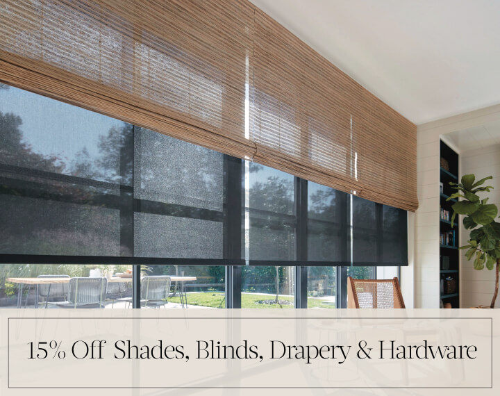 15% Off Shades, Blinds, Drapery & Hardware in black text over an image of Grassweave Cordless Woven Wood Shades in an office